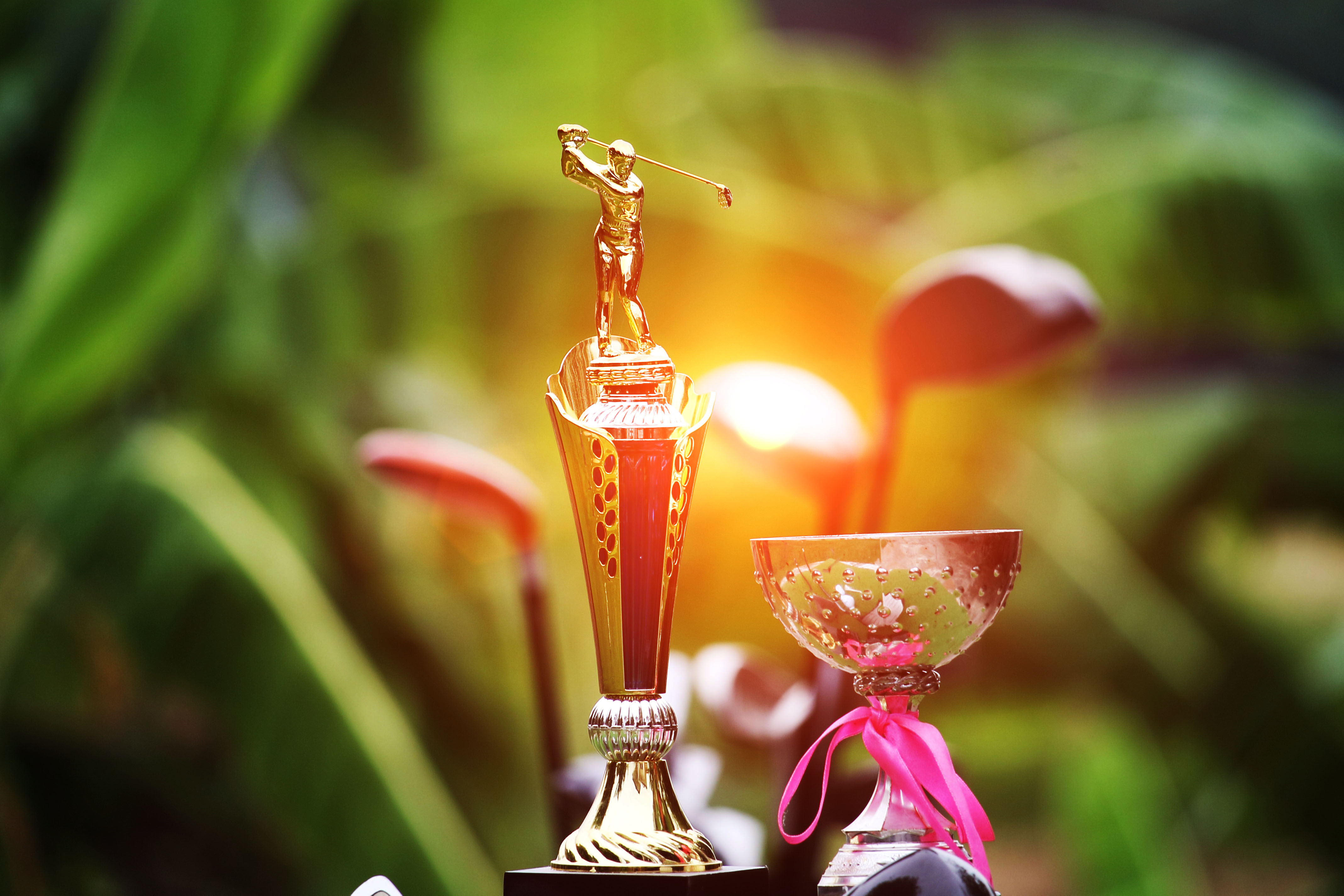 Golf trophy with warm sunset lighting